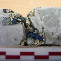 AK-18-026 @ 908.09m : Drill Core showing bornite and chalcopyrite